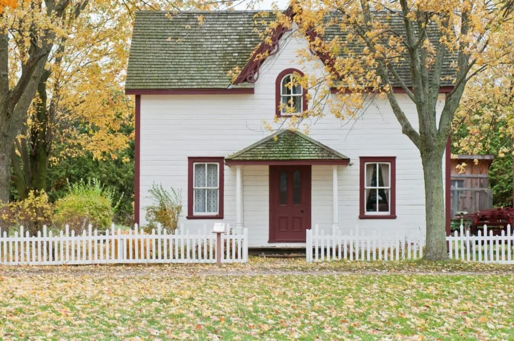 A family home framed by autumn trees